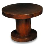 An Art Deco straight grain walnut occasional table, the circular top raised on central column and