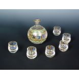 A late 19th century Russian glass vodka set, comprising decanter of bulbous form and six glasses,