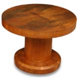 An Art Deco walnut occasional table, the circular top raised on central column and chamfered