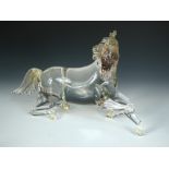 A Toso Murano glass model of a stallion, modelled partially reclining, the mane, tail and hooves