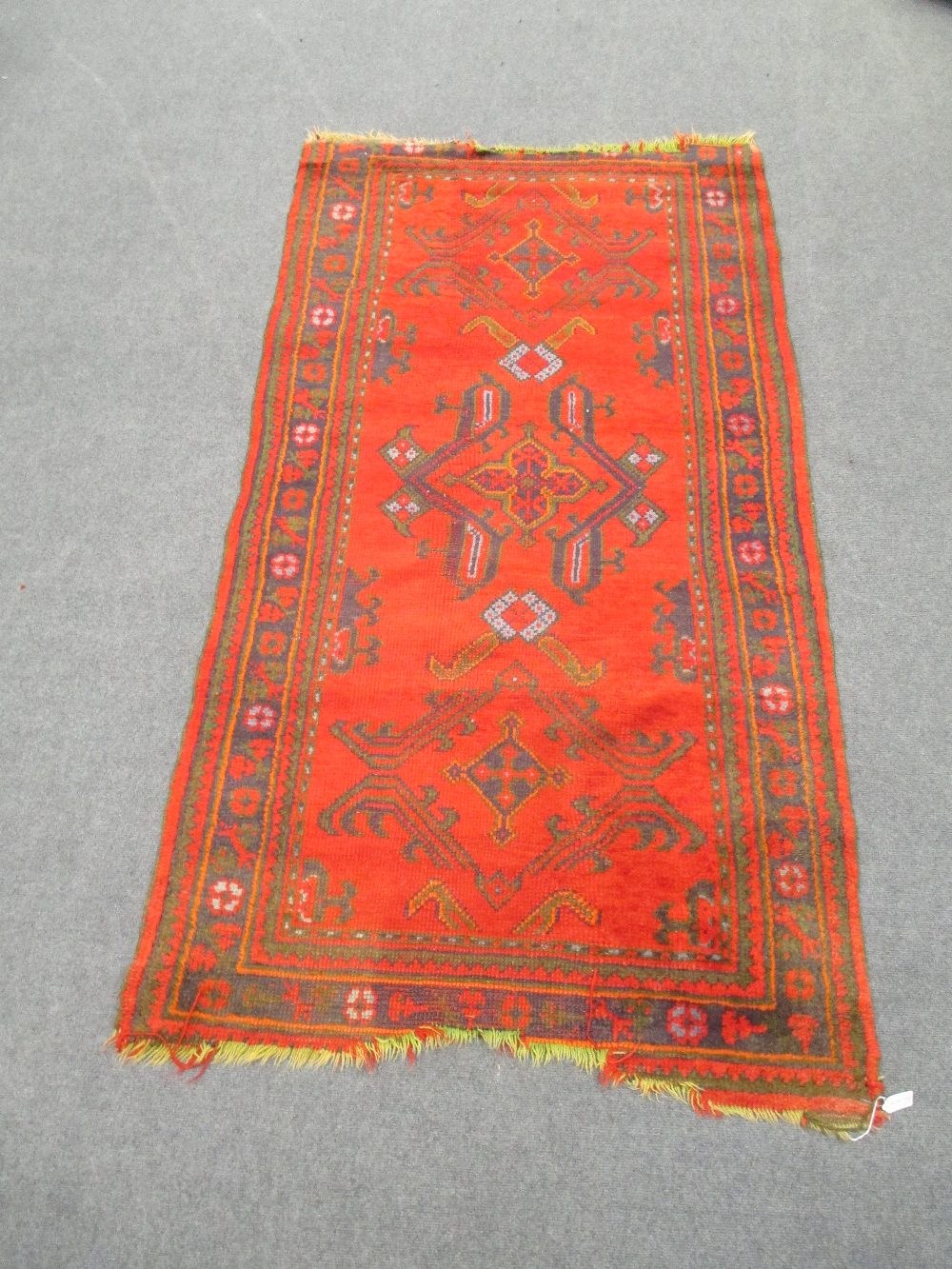 A red 'Turkey' rug and a shiraz rug 210 x 110cm and 150 x 112cm