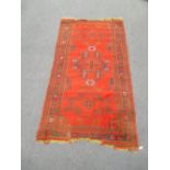 A red 'Turkey' rug and a shiraz rug 210 x 110cm and 150 x 112cm