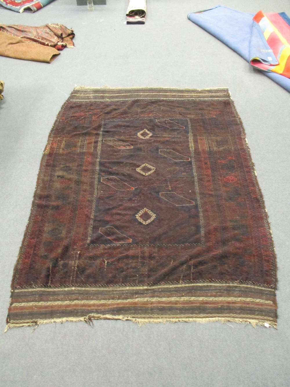 A Beluchi carpet 253 x 184cm