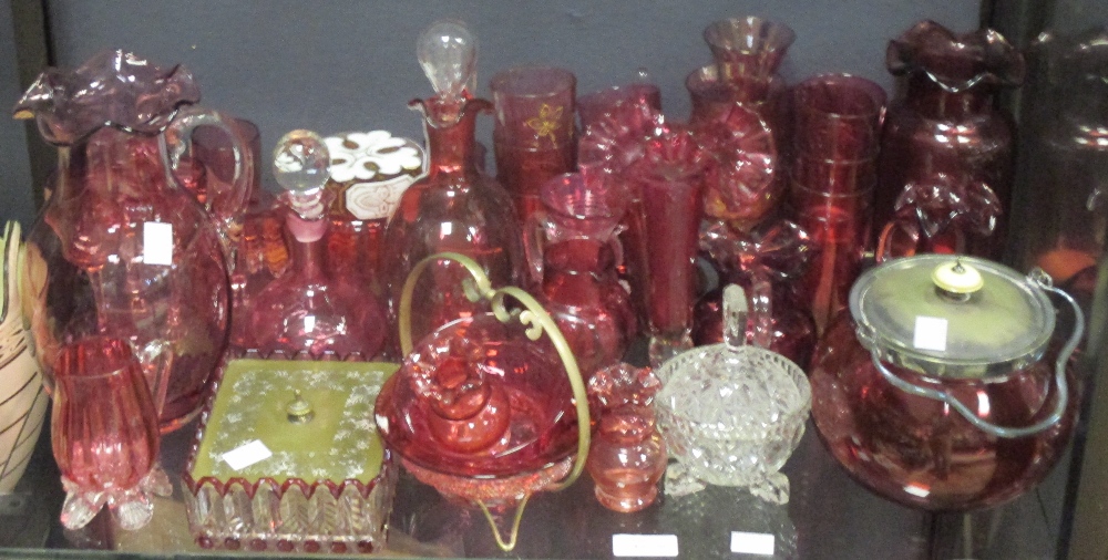 A collection of cranberry glass