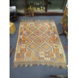 A Kilim rug with red ground and colour geometric patterned field 335 x 245cm