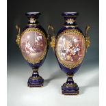A pair of 'Sevres' vases, date letter for 1753, painter's symbol for Vielliard, bronze mask