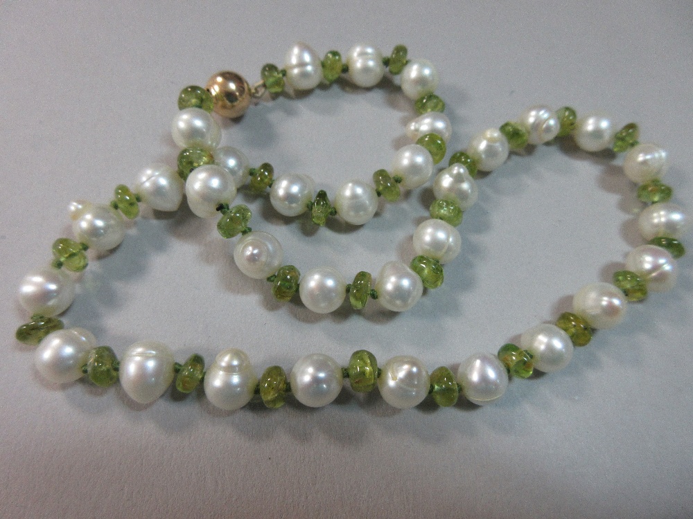 A peridot and pearl necklace, with alternating polished bouton peridots and 8mm freshwater pearls, - Image 2 of 3