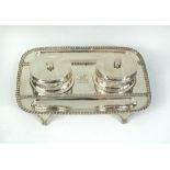An Edwardian silver two bottle inkstand, by The Barnards, London 1901, the rectangular tray with