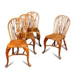 A set of four yew wood stick back chairs, late 19th century, with gothic carved and pierced