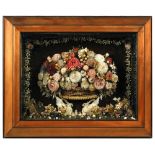A 19th century framed shell work relief, depicting a central basket of flowers supported on a