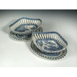 A pair of 18th century Turner blue and white pearlware pierced chestnut baskets and stands of