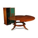 A Regency style circular mahogany extending dining table, 20th century, by Arthur Brett of Norwich
