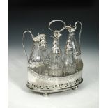 A George III silver piece cruet frame, by William Skeen, London 1792, the oval body decoratively