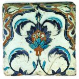 A 16th century Islamic Turkish Iznik square tile, decorated in blue and iron red with flowers and