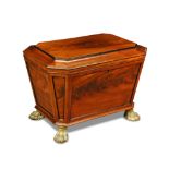 A Regency mahogany wine cooler, of sarcophagus design with ebonised outline panel mouldings and a