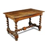 A Spanish walnut side table, late 17th century, with plank top and cleated ends, a single frieze