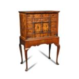 A South German walnut and marquetry inlaid cabinet on stand, 20th century, with earlier elements,