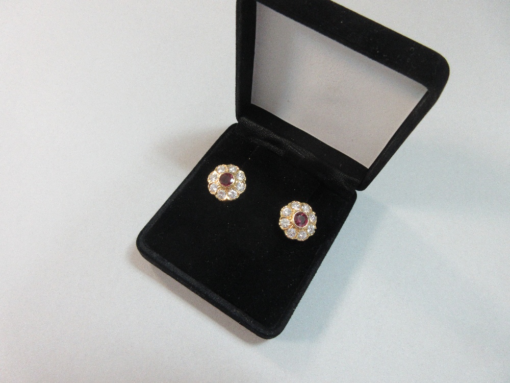 A pair of rhodolite and diamond flowerhead earstuds, each round cut rhodolite garnet collet set in a - Image 7 of 7