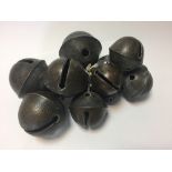 Eleven small 18th century bronze rumbler or croatal bells, cast in varying sizes with decoration and