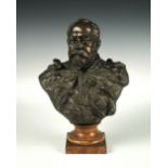 A bronzed bust of King Edward VII, mounted to a marble socle and plinth base 38cm (15in)