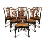 A set of six George III style mahogany dining chairs, late 19th century, with pierced backs,