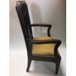 A George III mahogany child's chair, with drop in seat raised on tapering legs 60 x 39cm (23 x 15in)