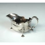 A small George II silver sauceboat, by Isaac Cookson, Newcastle 1743, the plain oval body of heavy