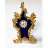 Unsigned - a small French ormolu framed dressing table timepiece, with inset blue enamel ground