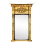 A Regency Grecian revival pier glass, 20th century, with mask and anthemion decorated frieze, and