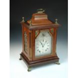 An Edwardian mahogany bracket clock, the traditional design case with brass stop fluted canted