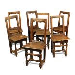 A harlequin set of seven small oak back stools, 18th century, of small size, with panel seats and on