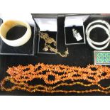 A small collection of jewellery, to include a coral necklace, an ivory bangle circa 1930, a pair