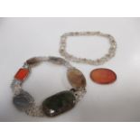 An agate bracelet and necklace and a jasper brooch inscribed in Arabic