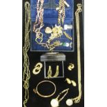 A 9ct gold chain with gold plated shilling pendant together with a good collection of further gold,