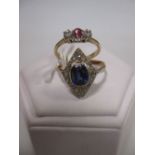 An Art Deco sapphire and diamond ring, the oval collet mounted sapphire, possibly synthetic or a