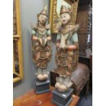 Two Indonesian polychrome wooden figures, 115cm high (2)