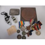 A bronze death penny, a WWI medal group, a silver cigarette case etc