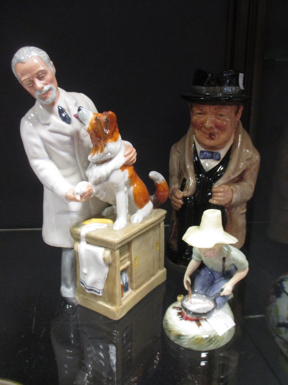 Three Doulton figures, to include thanks doc, Winston Churchill and River boy.