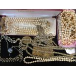 A pearl necklace together with a quantity of faux pearl necklaces and other costume jewellery