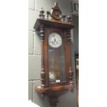 A 19th century walnut cased Vienna wall clock