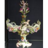 A German floral encrusted centrepiece with a putti removeable cover