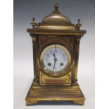 A Benson of London mantle clock, lacquered cast case with white dial and bell with striking French