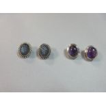 A pair of carved labradorite and silver earclips by Stephen Dweck together with a pair of amethyst