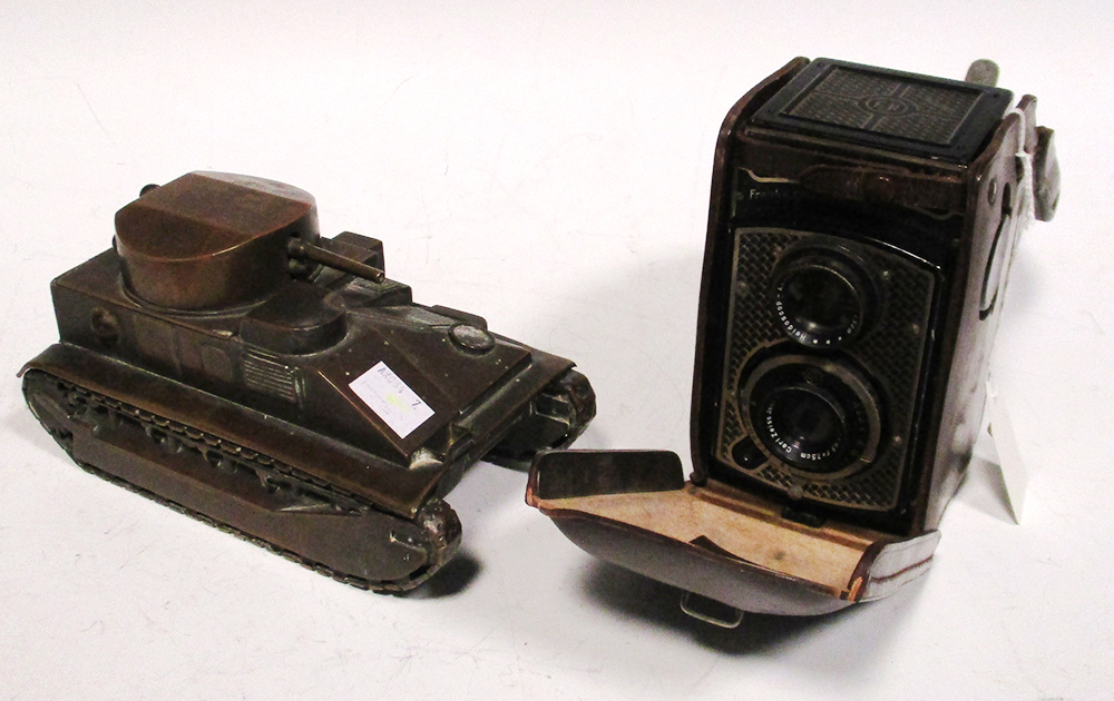 A brass model of a Vickers medium tank, the push down barrel opening a lid, 18cm long, together with