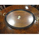 A mahogany two-handled round tray, 49 x 59 cm