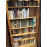 A general collection of books, several shelves, mainly 20th century, novels, reference, etc