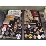 Collection of mixed WWII militaria, badges, buttons, mainly German including a French helmet