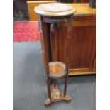 A mahogany torchere, 100 cm high