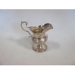 A small silver cream jug by Nathan and Hayes, Chester 1908