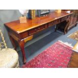 A mahogany hall table, the long narrow top with frieze drawers, on cabriole legs, 76 x 180 x 49 cm